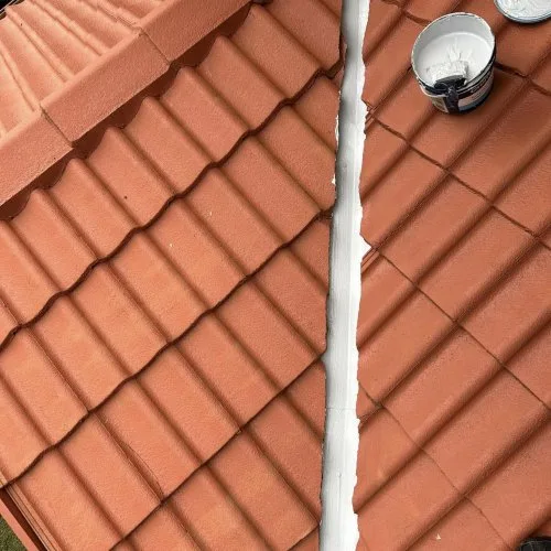 Terracotta tiled roof with coating equipment image from the GTA Roofing website